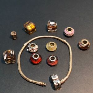 Pandora-like bracelet and charms. Length is 7.9”